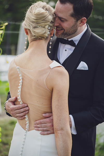 groom holding brides back