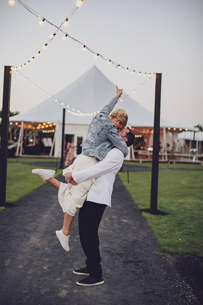 groom picking up bride